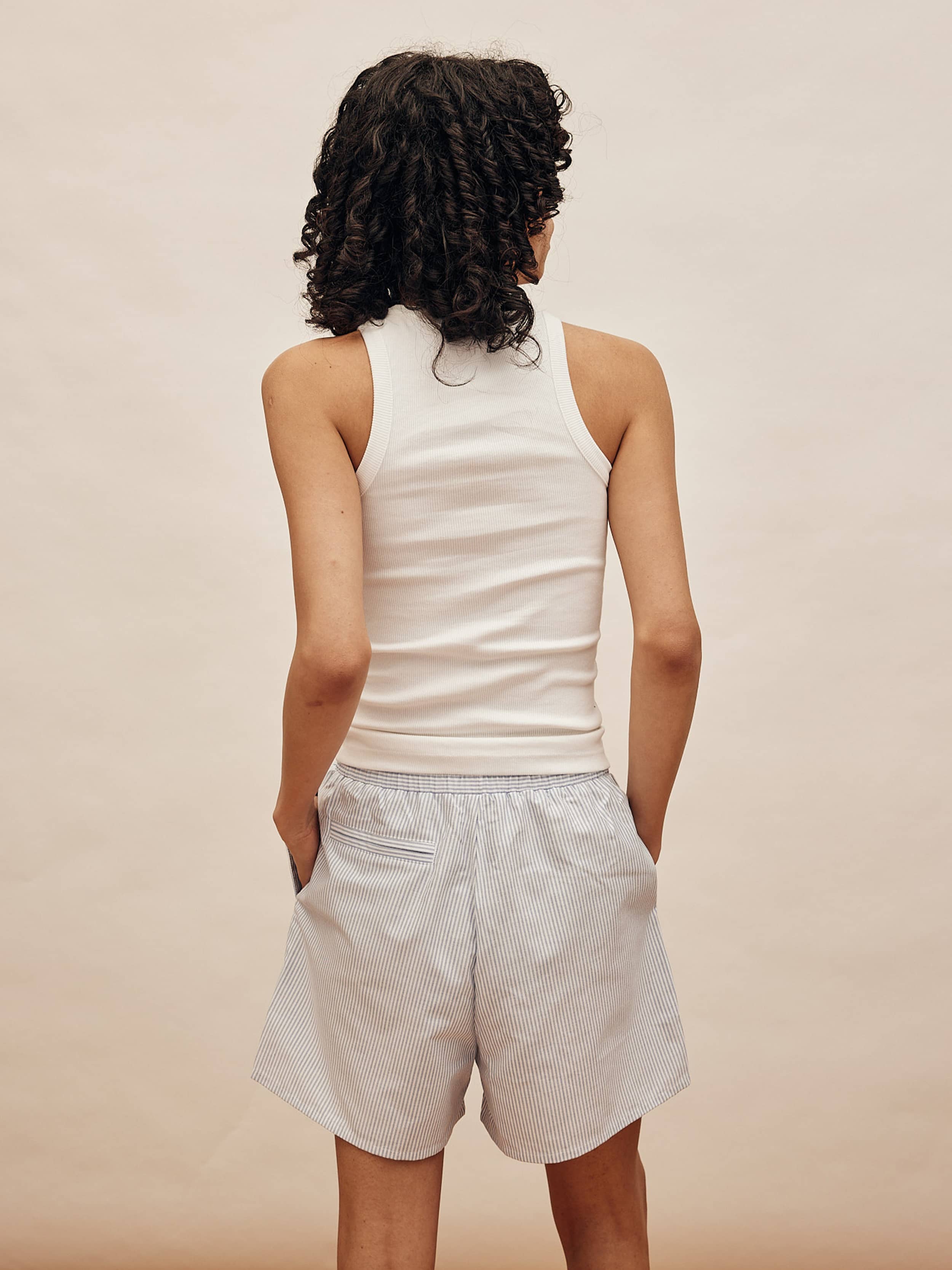 efu EATHER SLEEVELESS TOP ホワイトF Sleeveless Tee – Newkid Archive
